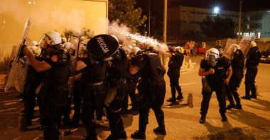 Riot police fire tear gas in front of a police station in Podgorica, Montenegro, June 24, 2020. (Reuters Photo)