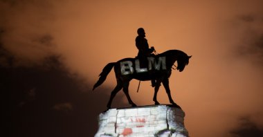 Artist Dustin Klein projects a Black Lives Matter image onto the statue of Confederate Gen. Robert E. Lee in Richmond, Virginia, U.S., June 18, 2020. (Reuters Photo)