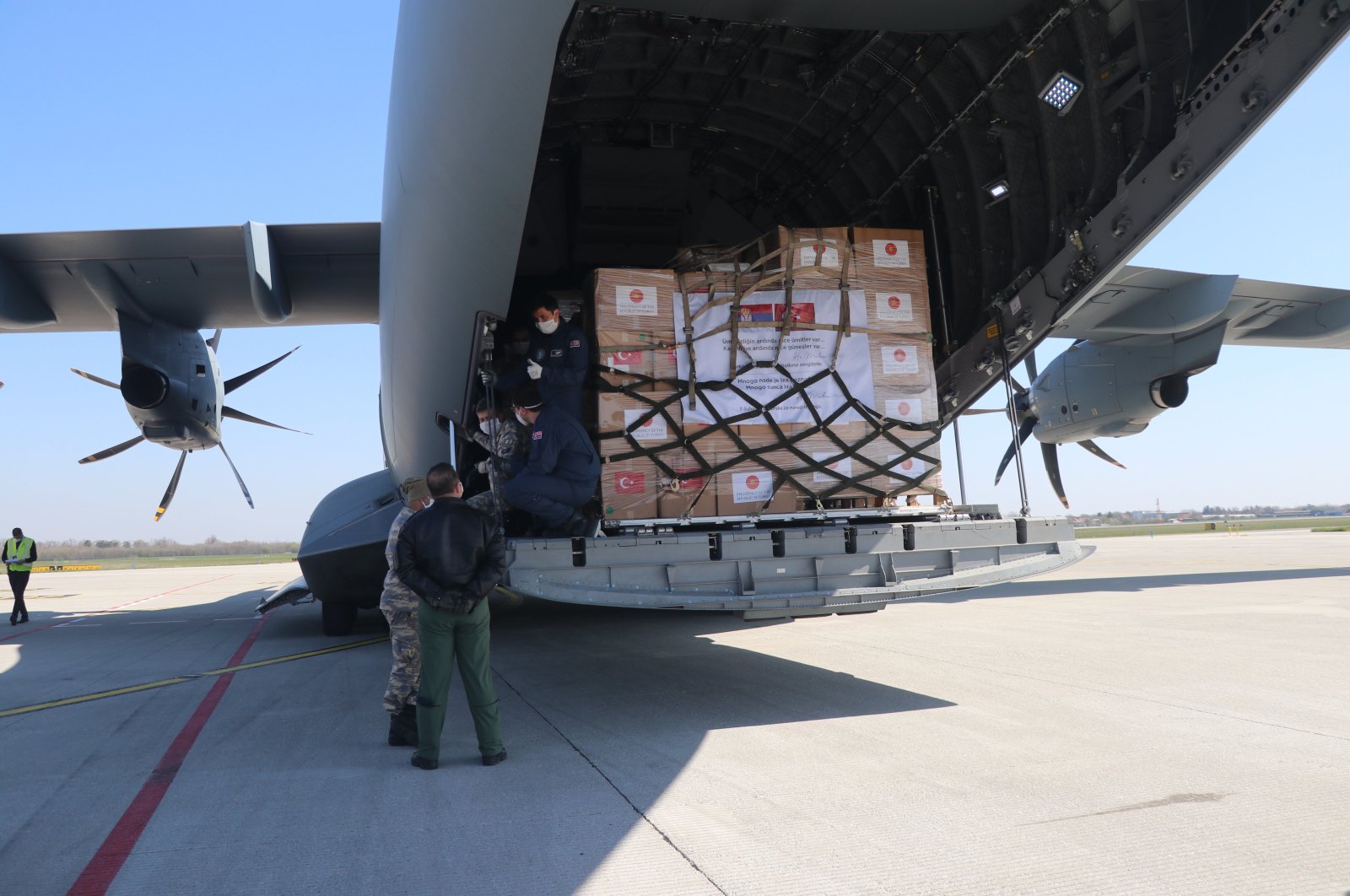 A military cargo plane carrying medical equipment from Turkey to Serbia lands in the Serbian capital Belgrad, April 10, 2020. (AA Photo)