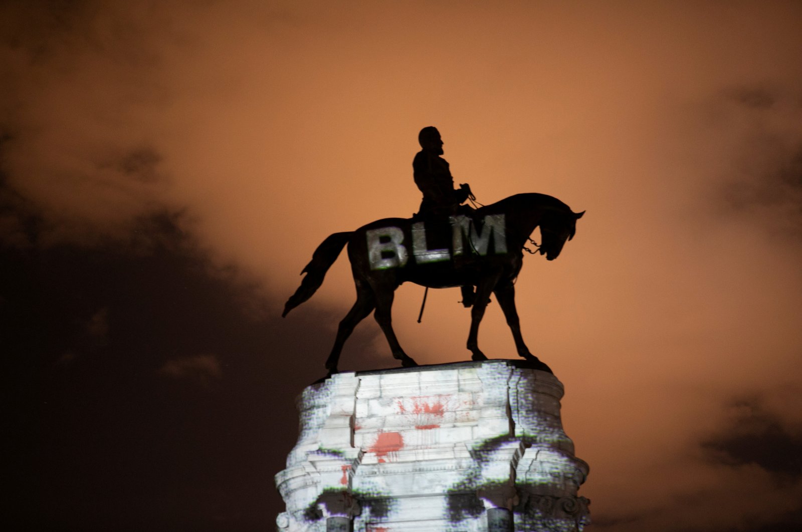 Artist Dustin Klein projects a Black Lives Matter image onto the statue of Confederate Gen. Robert E. Lee in Richmond, Virginia, U.S., June 18, 2020. (Reuters Photo)