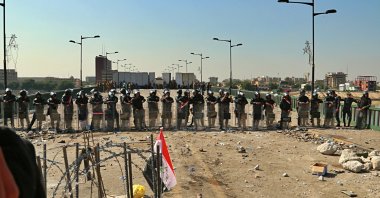 Security forces close the bridge leading to the Green Zone during a demonstration in Baghdad, Oct. 26, 2019. (AP Photo)