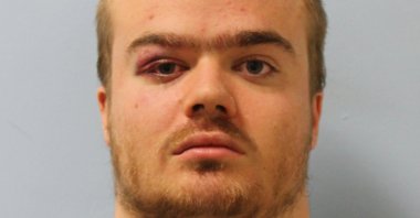 A handout photograph released by the Metropolitan Police shows Jonty Bravery posing for his custody photograph in London, Dec. 6, 2019.(AFP Photo/Metropolitan Police)