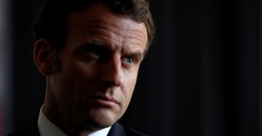 French President Emmanuel Macron talks with social workers and volunteers in charge of assisting the elderly in the area during a visit at a communal center for social action (CCAS) in La Courneuve near Paris as the spread of the coronavirus disease (COVID-19) continues in France, April 7, 2020. (Reuters Photo)