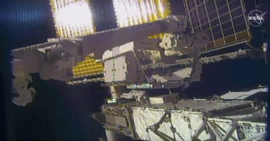 This photo provided by NASA shows NASA astronaut Chris Cassidy and NASA Flight Engineer Bob Behnken during a spacewalk outside the International Space Station on Friday, June 26, 2020. (NASA via AP)