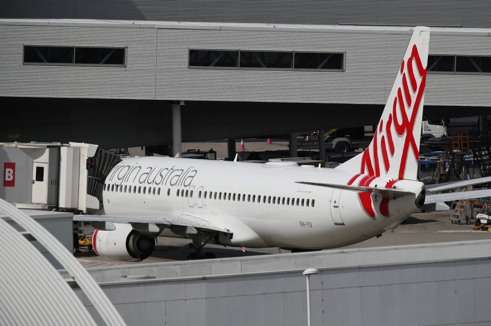 A Virgin Australia Airlines plane is seen at Kingsford Smith International Airport the morning after Australia implemented an entry ban on non-citizens and non-residents intended to curb the spread of the coronavirus disease (COVID-19) in Sydney, Australia, March 21, 2020. (Reuters File Photo)