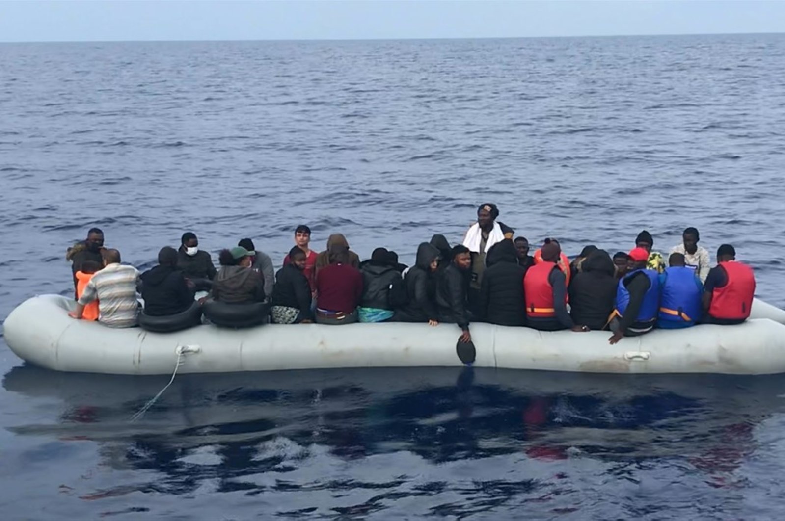 Turkish Coast Guard boats rescued 62 asylum-seekers in the Aegean Sea off Turkey's northwestern Deveboynu district of Çanakkale province, June 25, 2020. (AA Photo)