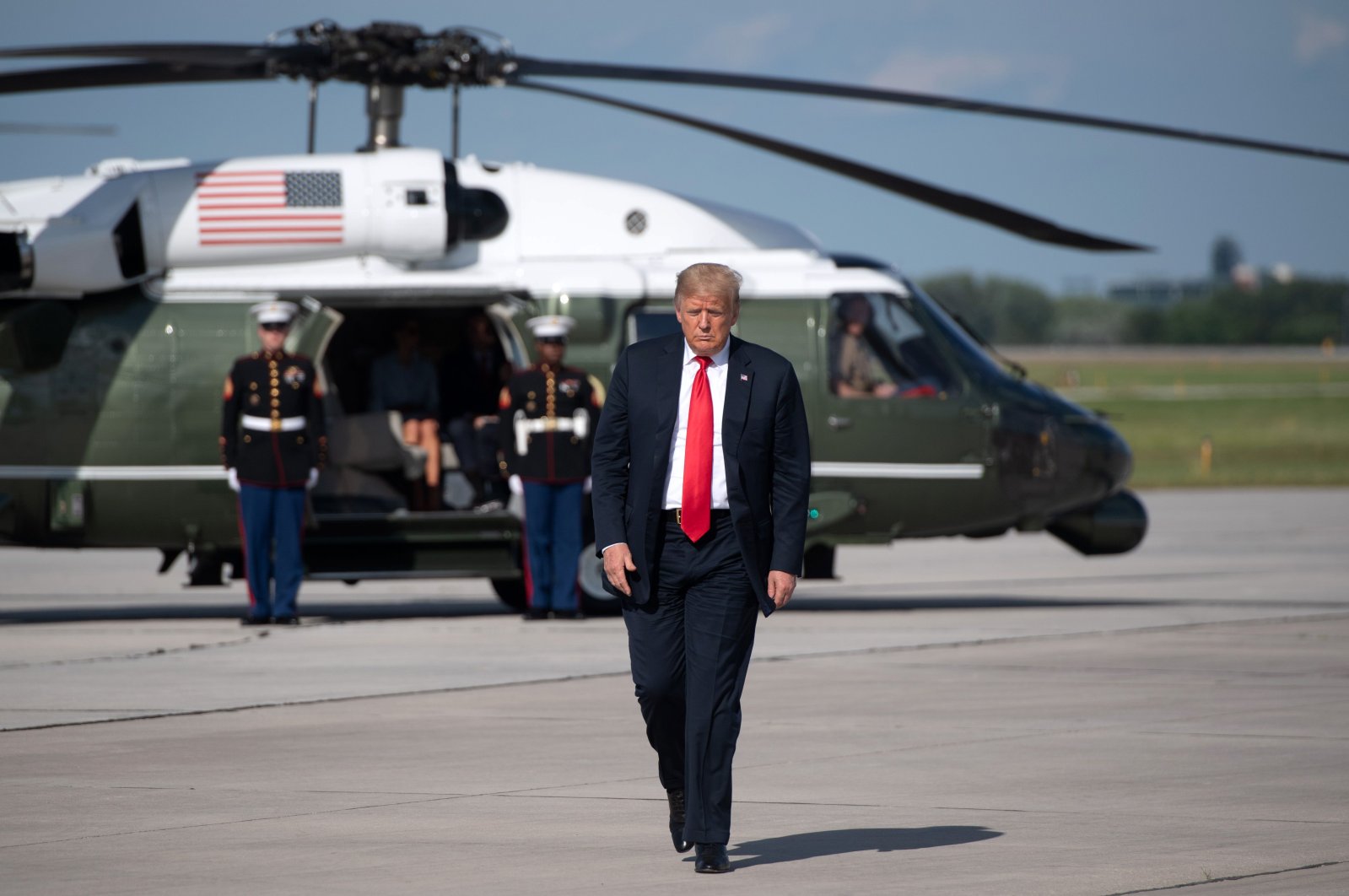 U.S. President Donald Trump walks to board Air Force One prior to its departure from Austin Straubel International Airport in Green Bay, Wisconsin, June 25, 2020. (AFP Photo)