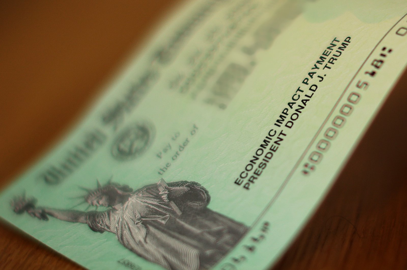 U.S. President Donald Trump's name appears on the coronavirus economic assistance checks that were sent to citizens across the country, Washington, D.C., April 29, 2020. (AFP Photo)