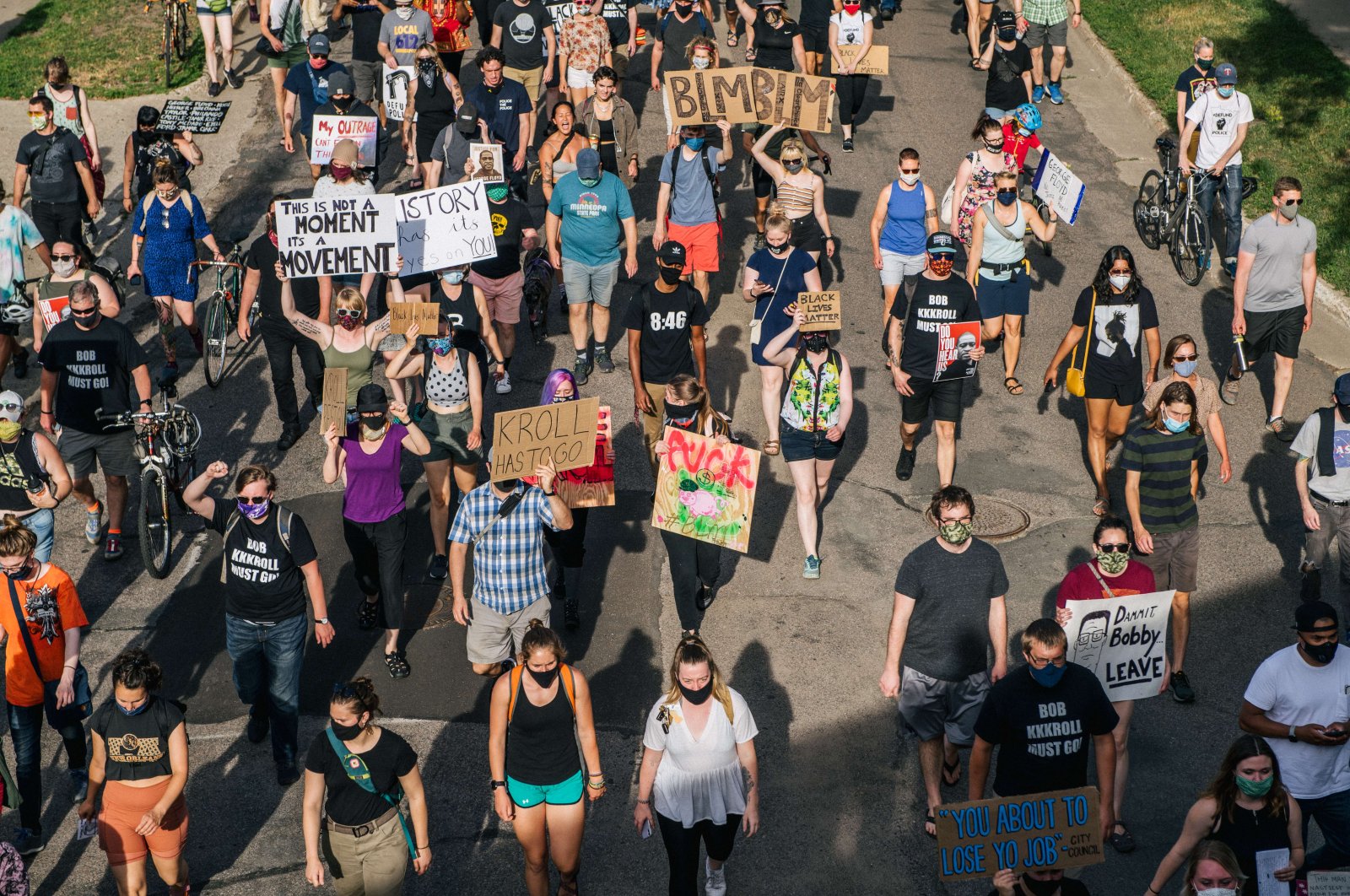 People march in the street, calling for Minneapolis Police Union Lt. Bob Kroll to be fired, in Minneapolis, Minnesota, June 25,2020. (AFP Photo) 