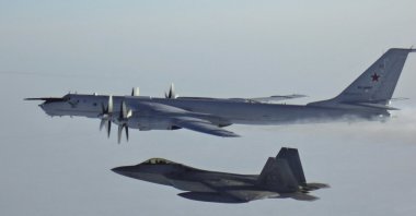 In this Monday, March 9, 2020 file photo released by the North American Aerospace Defense Command (NORAD), a Russian Tu-142 maritime reconnaissance aircraft, top right, is intercepted near the Alaska coastline. (AP Photo)