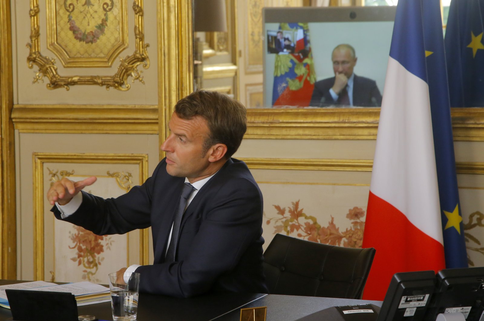 French President Emmanuel Macron talks to Russian President Vladimir Putin during a video conference at the Elysee Palace in Paris, June 26, 2020. (AP)