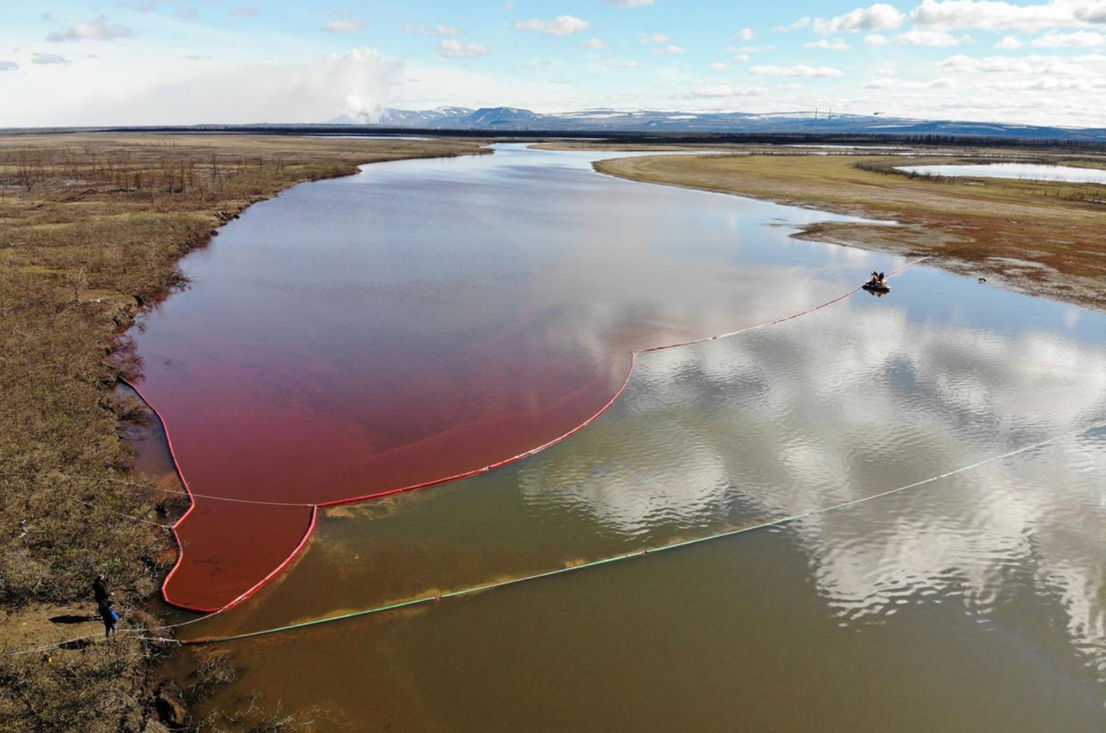 This handout photograph taken and released by the Marine Rescue Service of Russia shows a large diesel spill in the Ambarnaya River outside Norilsk, Russia, June 3, 2020. (AFP Photo / Marine Rescue Service of Russia)