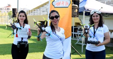 Muratpaşa Municipality Mayor Ümit Uysal (not pictured) granted a certificate to all seven crew members of the Pasha FPV Team, including Turkey’s first female drone racers (pictured), June 29, 2020. (IHA Photo)