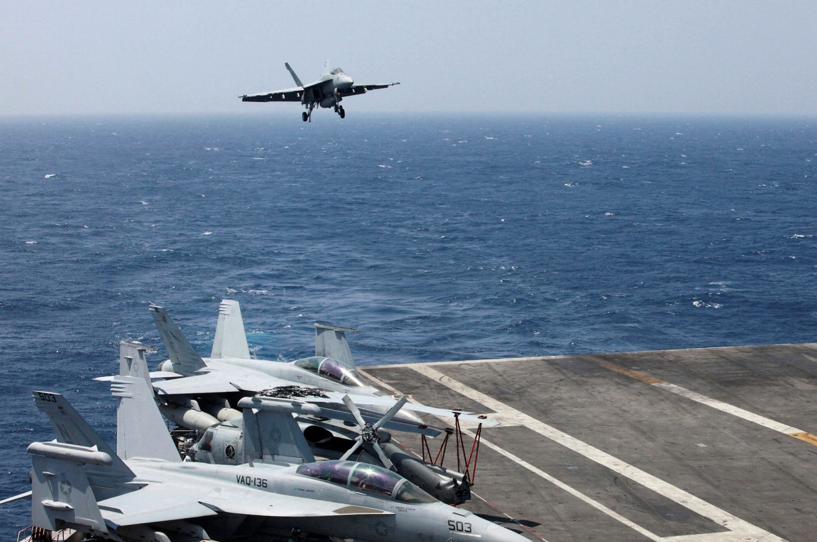 An F-18 fighter jet lands on the U.S Navy aircraft carrier USS Carl Vinson (CVN 70) following a patrol of the disputed South China Sea, March 3, 2017. (AP Photo)