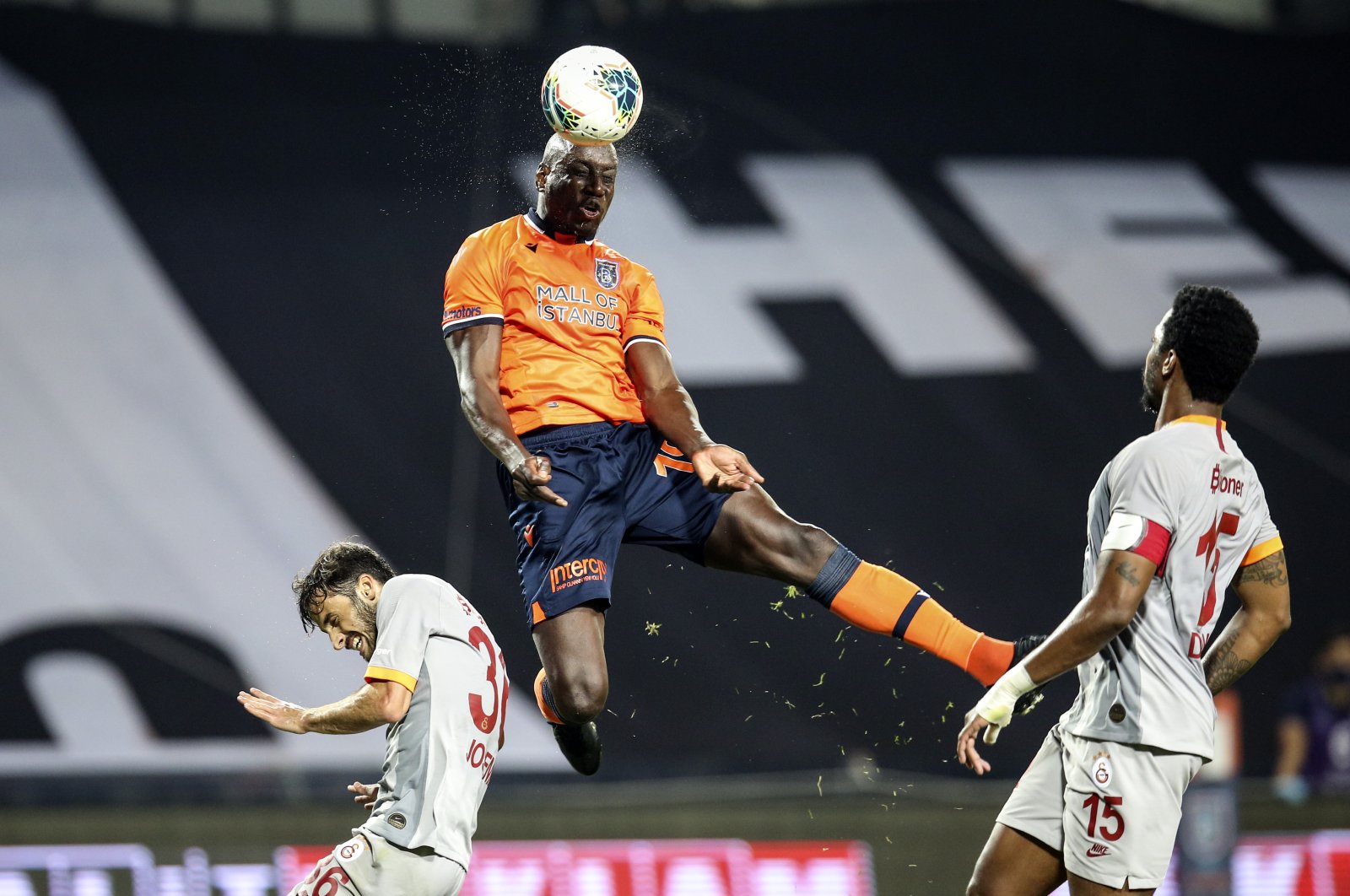 Başakşehir's Demba Ba (C) confronts Galatasaray's Ryan Donk (R) and Marcelo Saracchi (L) during the match in Istanbul, Turkey, June 28, 2020. (AA Photo) 