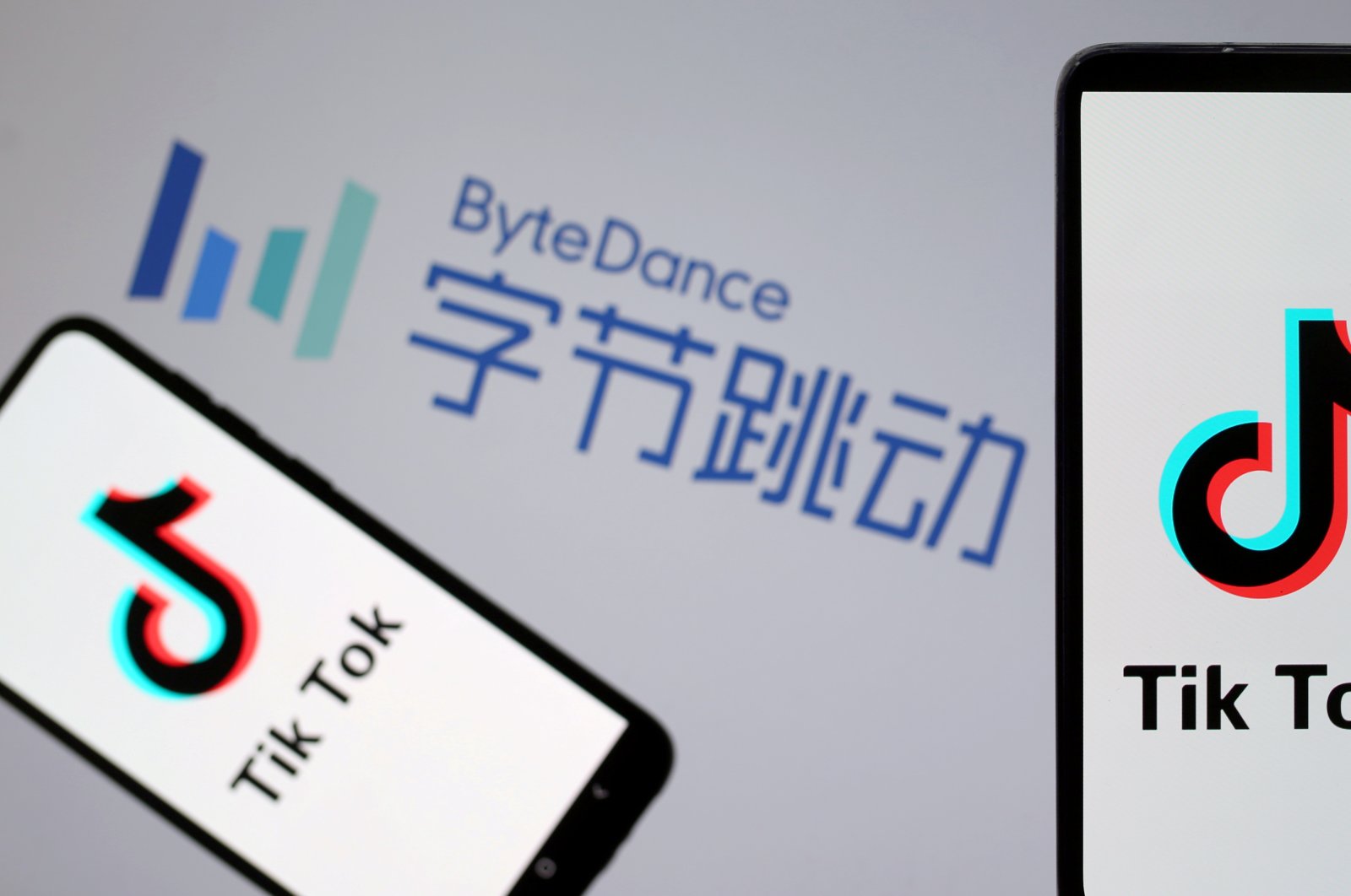 TikTok logos are seen on smartphones in front of a displayed ByteDance logo in this illustration taken Nov. 27, 2019. (Reuters Photo)