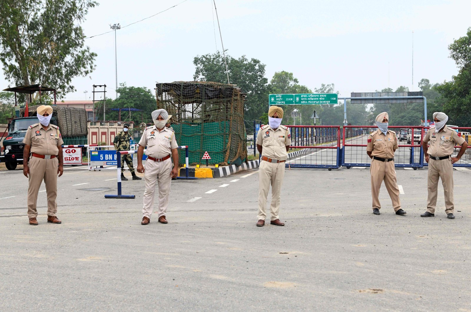 Indian police personnel stand guard near India-Pakistan Wagah border post, June 25, 2020. (AFP Photo)