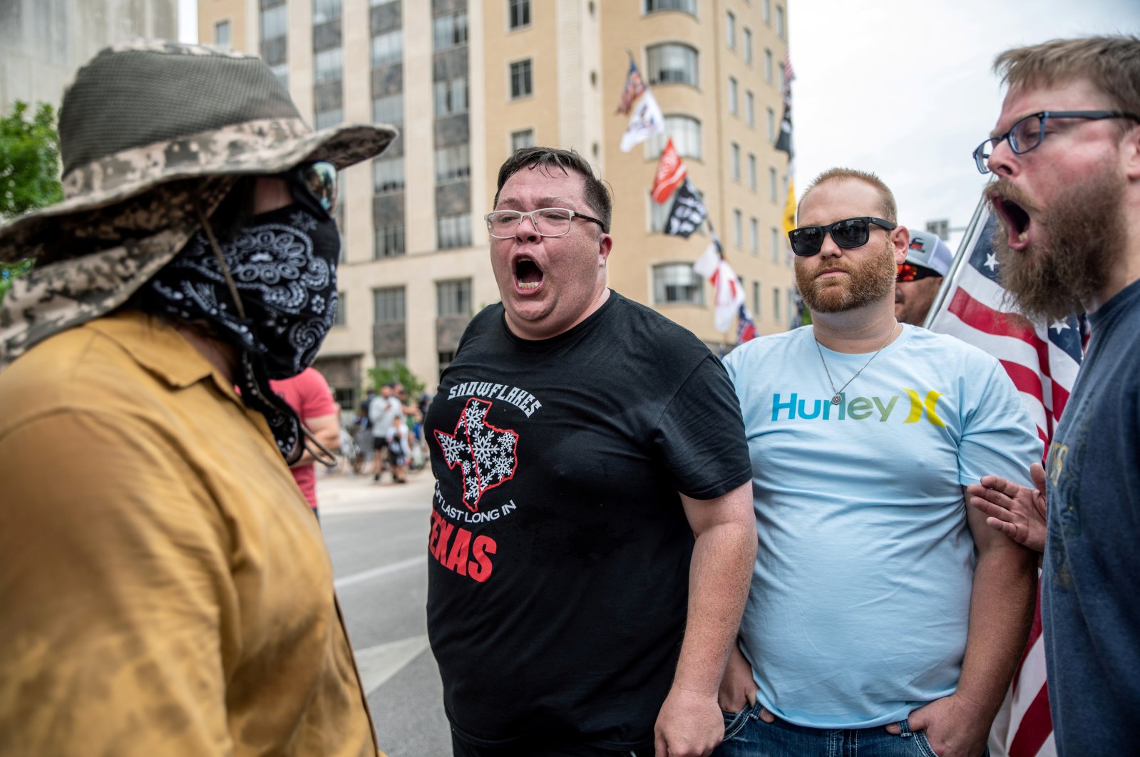 Photo shows mask-averse males protesting against mandates to wear masks amid the COVID-19 outbreak in Austin, Texas, U.S., June 28, 2020. (Reuters Photo)