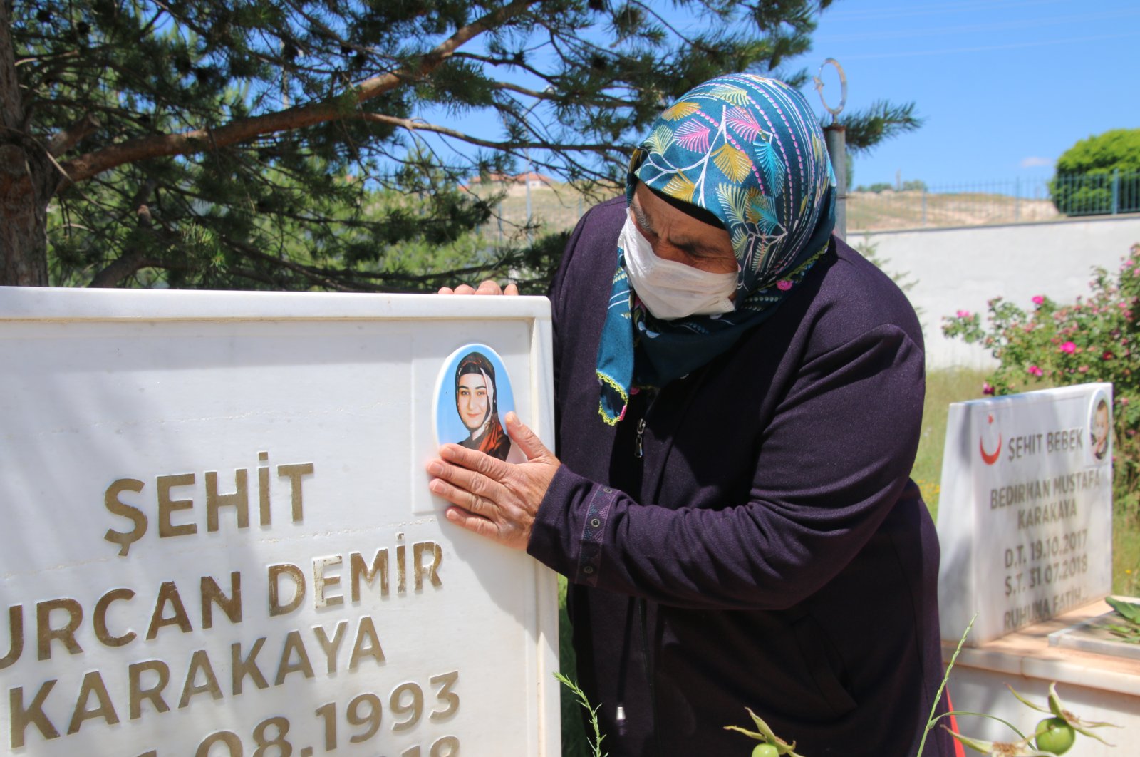 Suudiye Demir visits her daughter's grave following the news that her killer, PKK terrorist, has been killed, June 30, 2020. (AA) 