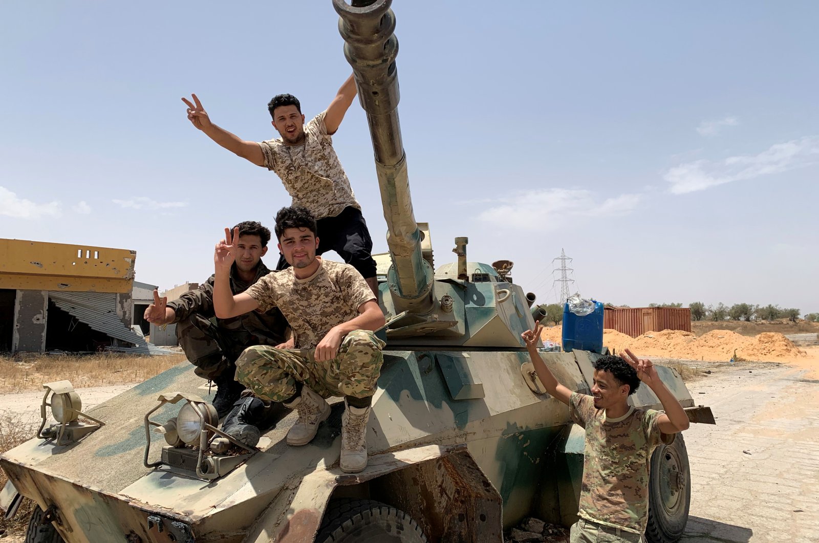 Fighters loyal to Libya's internationally recognized government celebrate after regaining control over the city, in Tripoli, Libya, June 4, 2020. (REUTERS Photo)