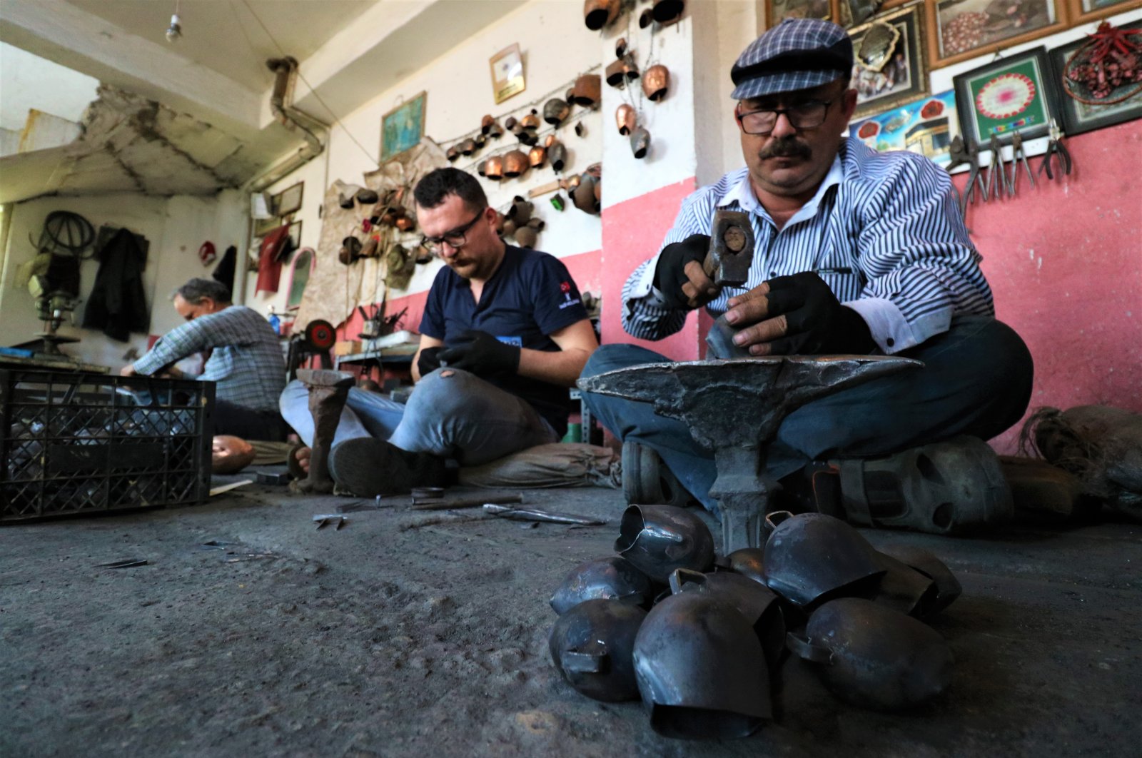The Çancı family crafts bells in their workshop, in Manisa, Turkey, June 30, 2020. (IHA Photo) 