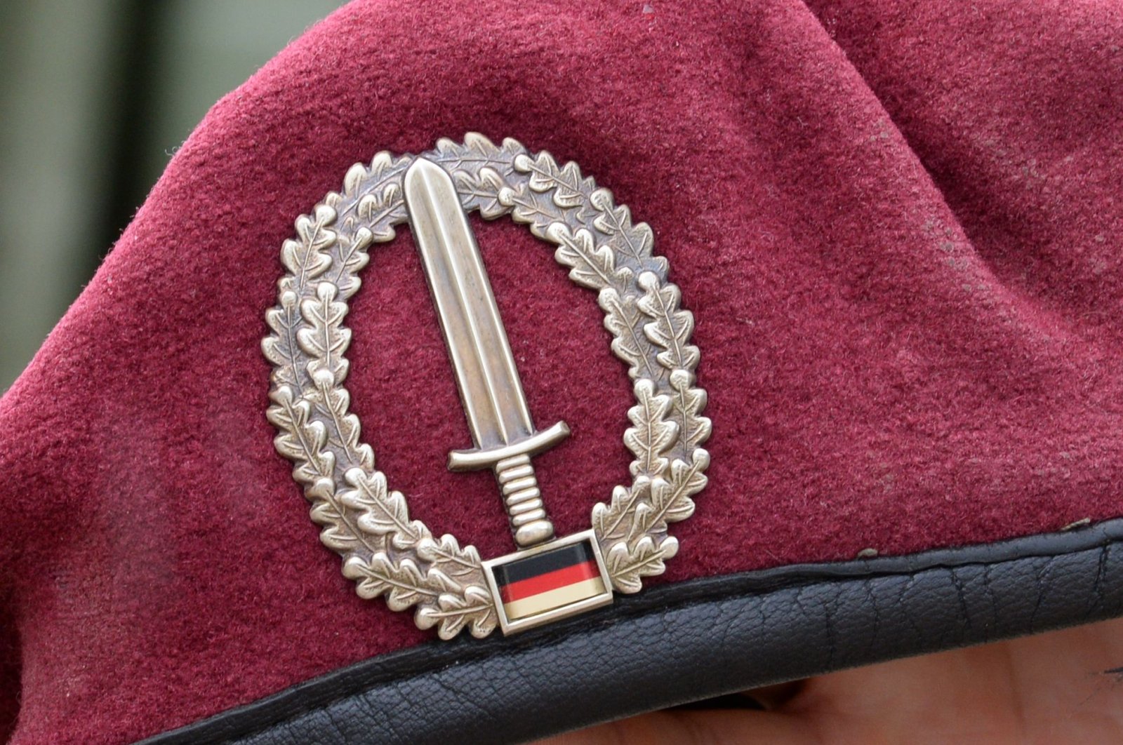 Picture taken on July 14, 2014 shows the emblem of the KSK (Kommando Spezialkraefte) special unit of Germany's armed forces Bundeswehr seen on the beret of a soldier taking part in a military exercise in Calw near Sindelfingen, southern Germany. (AFP Photo)