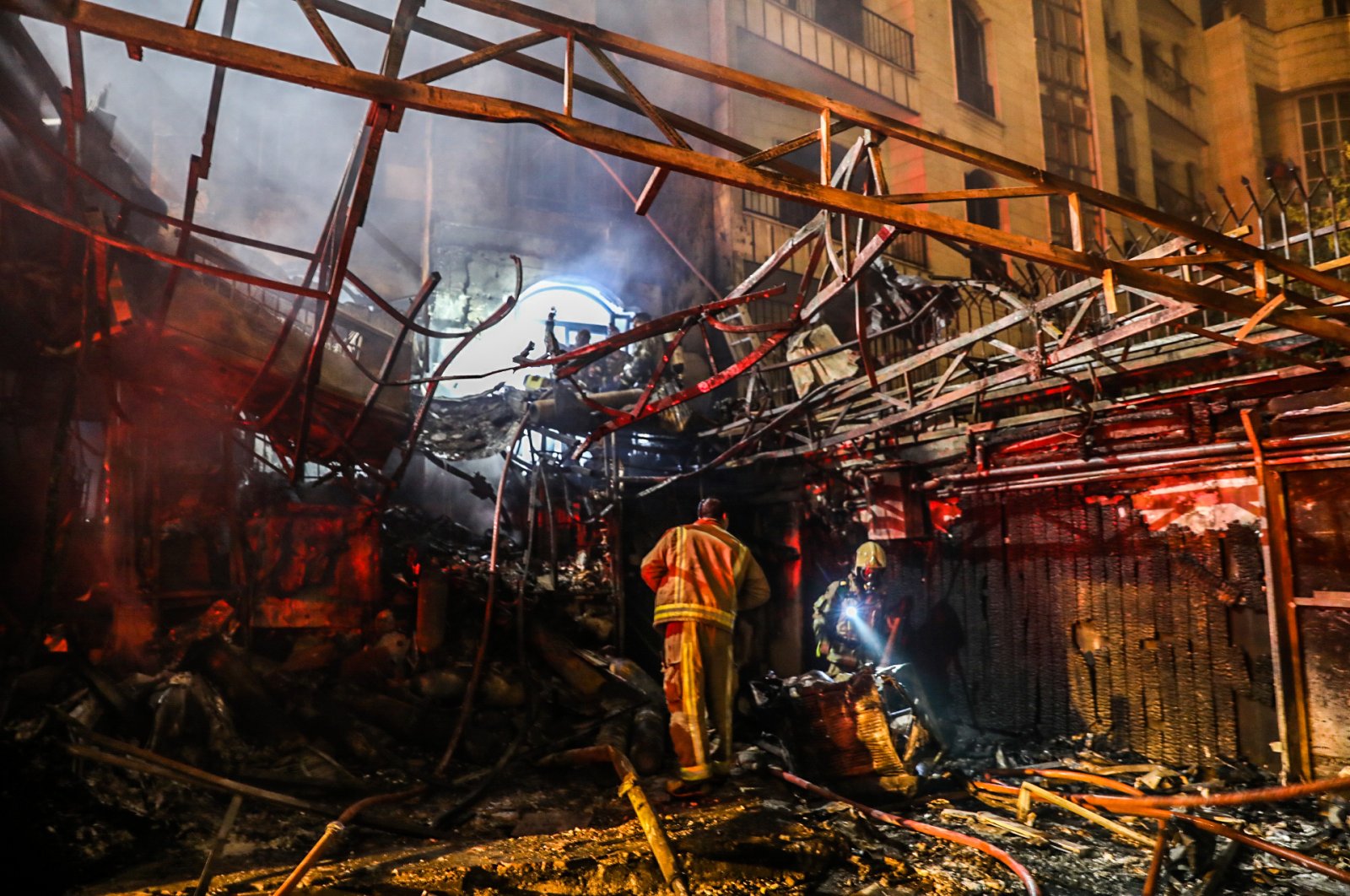 First responders search for survivors at the scene of an explosion at the Sina At'har health center in Tehran, Iran, June 30, 2020. (AFP Photo)
