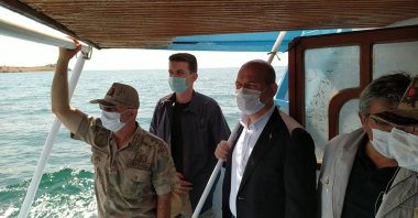 Interior Minister Süleyman Soylu (R), inspects the rescue work in Lake Van following the sinking of a migrant boat, July 1, 2020. (IHA)