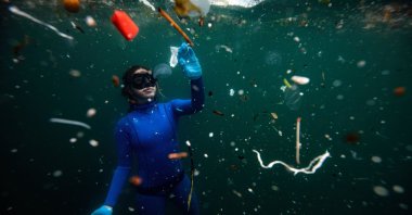 Şahika Ercümen's dive drew attention to the extent of the plastic waste pollution in our waters. (AA Photo)