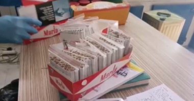 Hand-rolled cigarettes containing illegally sold tobacco are seized by police in Izmir, Turkey, June 27, 2020. (IHA Photo)