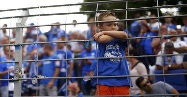 In this Aug. 15, 2015, file photo, a child attends the soccer match between SV Darmstadt 98 and Hanover 96 before their German first division Bundesliga soccer match in Darmstadt, Germany. (Reuters Photo)