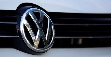 The logo of German carmaker Volkswagen is seen on a car outside a garage in Vienna, Austria, Sept. 29, 2016. (Reuters Photo)