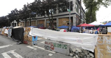 Cement barricades are fortified with chunks of concrete and tarps in front of the Seattle Police Department East Precinct building at the Capitol Hill Occupied Protest zone in Seattle, Washington, U.S., June 30, 2020. (AP Photo)