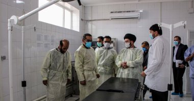 Afghanistan's Health Minister Ahmad Jawad Osmani (2L) visits maternity rooms during the inauguration reopening ceremony of a medical ward at MSF Hospital, Kabul, July 1, 2020. (AFP Photo)