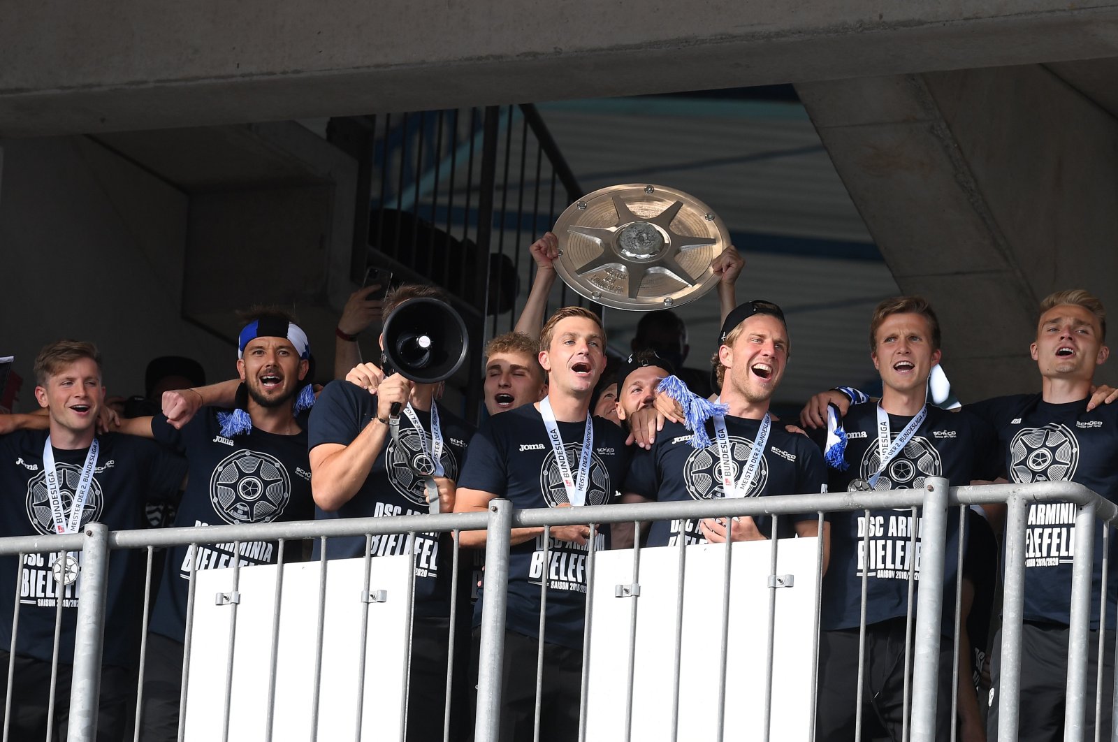 Players of Bielefeld celebrate with the championship trophy after the German Bundesliga Second Division match between DSC Arminia Bielefeld and FC Heidenheim 1846 in Bielefeld, Germany, June 28, 2020. (EPA Photo)