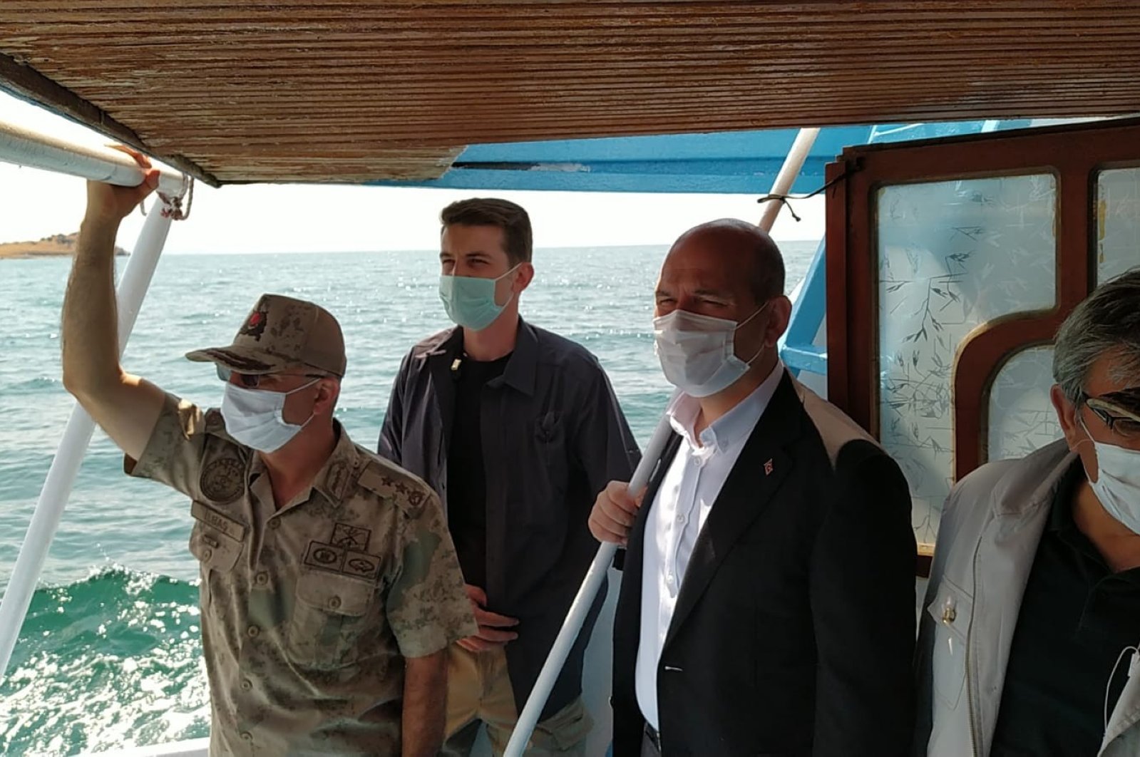 Interior Minister Süleyman Soylu (R), inspects the rescue work in Lake Van following the sinking of a migrant boat, July 1, 2020. (IHA)
