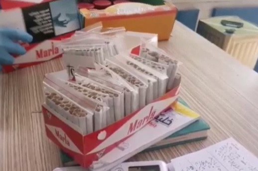 Hand-rolled cigarettes containing illegally sold tobacco are seized by police in Izmir, Turkey, June 27, 2020. (IHA Photo)