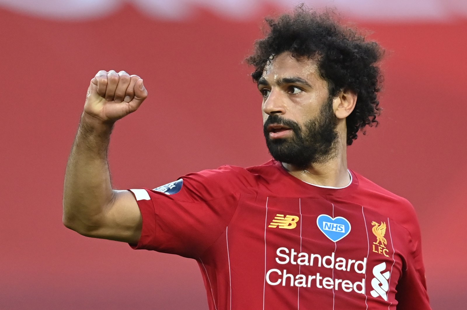 Liverpool's Mohamed Salah celebrates scoring their second goal as play resumes behind closed doors following the outbreak of COVID-19. (Reuters Photo)
