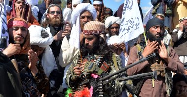 Afghan Taliban militants and villagers attend a gathering as they celebrate the peace deal and their victory in the Afghan conflict on U.S. in Afghanistan, in Alingar district of Laghman Province, March 2, 2020. (AFP Photo)