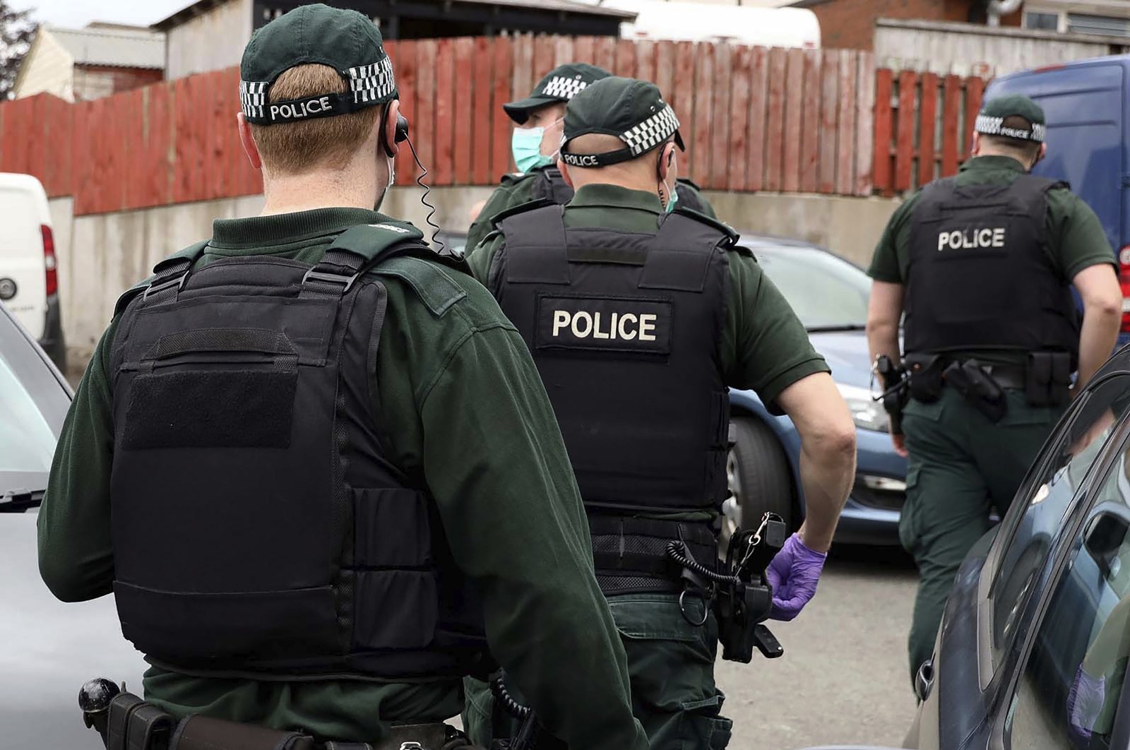 The picture shows police during a raid in Operation Venetic, an investigation on Encrochat, a military-grade encrypted communication system used by organised criminals trading in drugs and guns, July 2, 2020. (AP)