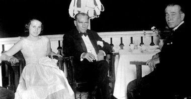 Ali Fethi's daughter Nermin Hanım (L), Mustafa Kemal Atatürk (C) and Fethi Okyar (R) in Yalova, northwestern Turkey, Aug. 13, 1930.