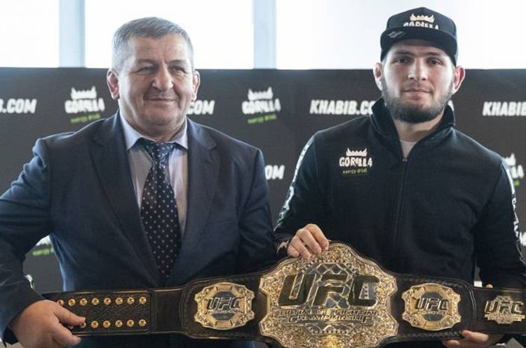 Abdulmanap Nurmagomedov (L), the father and longtime trainer of UFC star Khabib Nurmagomedov, with his son. (AP Photo)