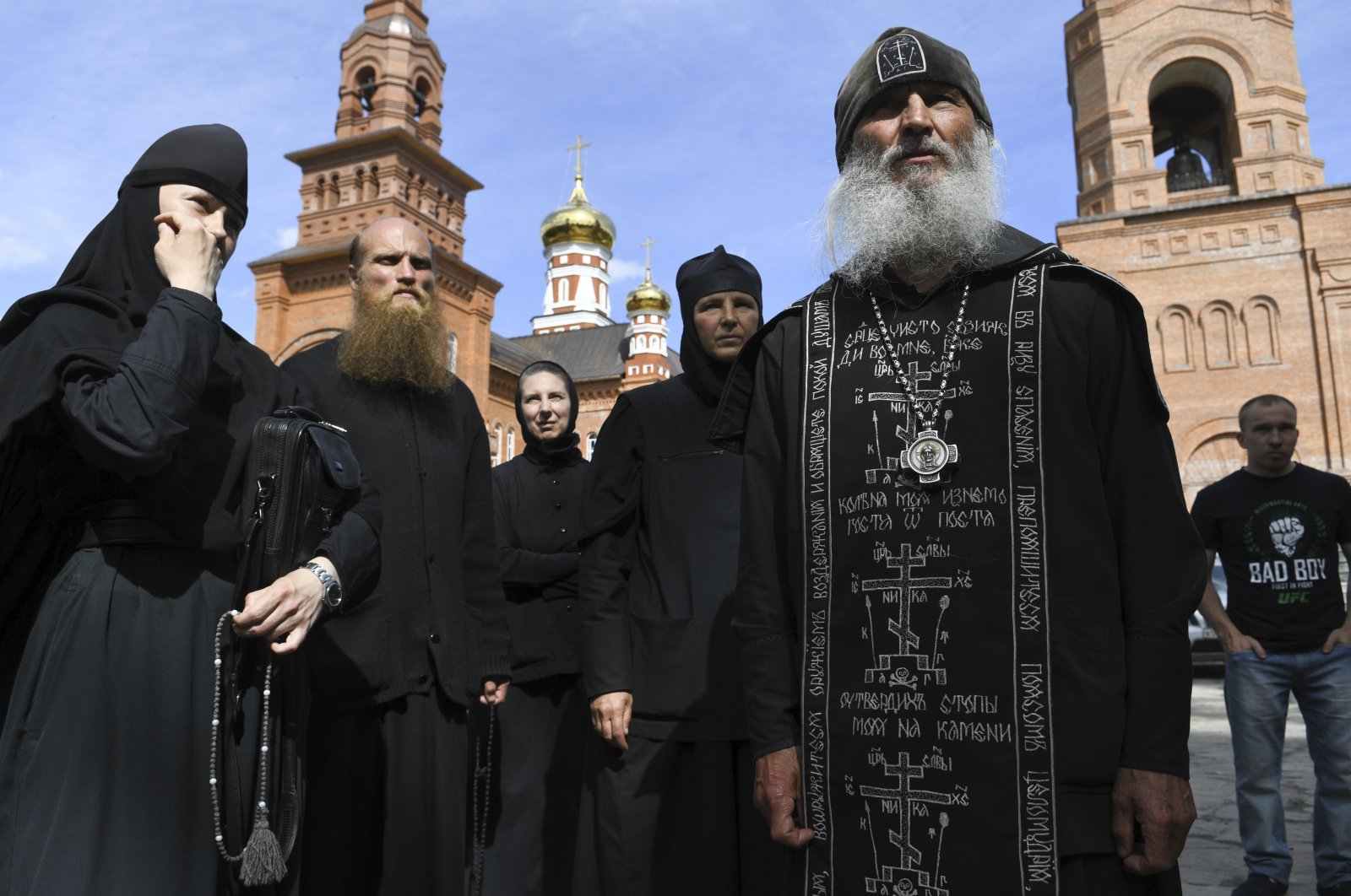 Father Sergiy, a Russian monk who has defied the Russian Orthodox Church's leadership, right, speaks to journalists in Sredneuralsk, in the Russian Urals on Wednesday, June 17, 2020. (AP Photo)