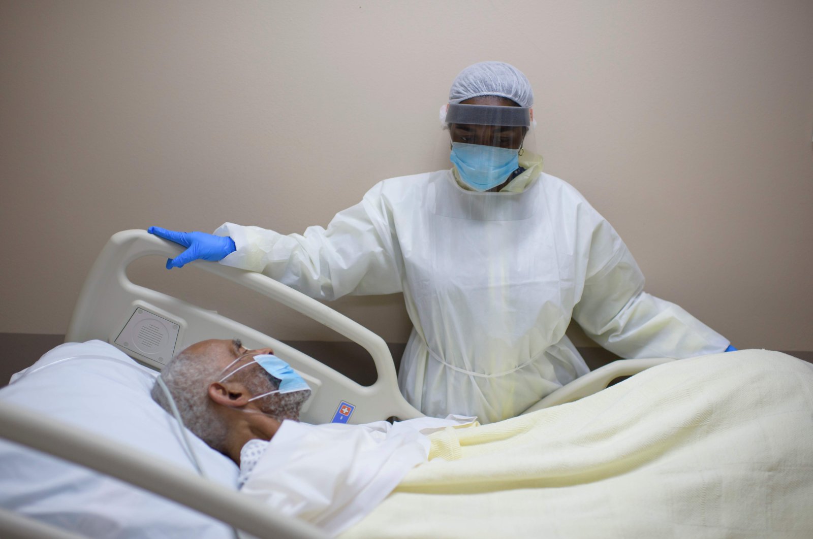 A healthcare worker tends to a patient in the COVID-19 unit at United Memorial Medical Center in Houston, Texas, US on July 2, 2020. (AFP Photo)