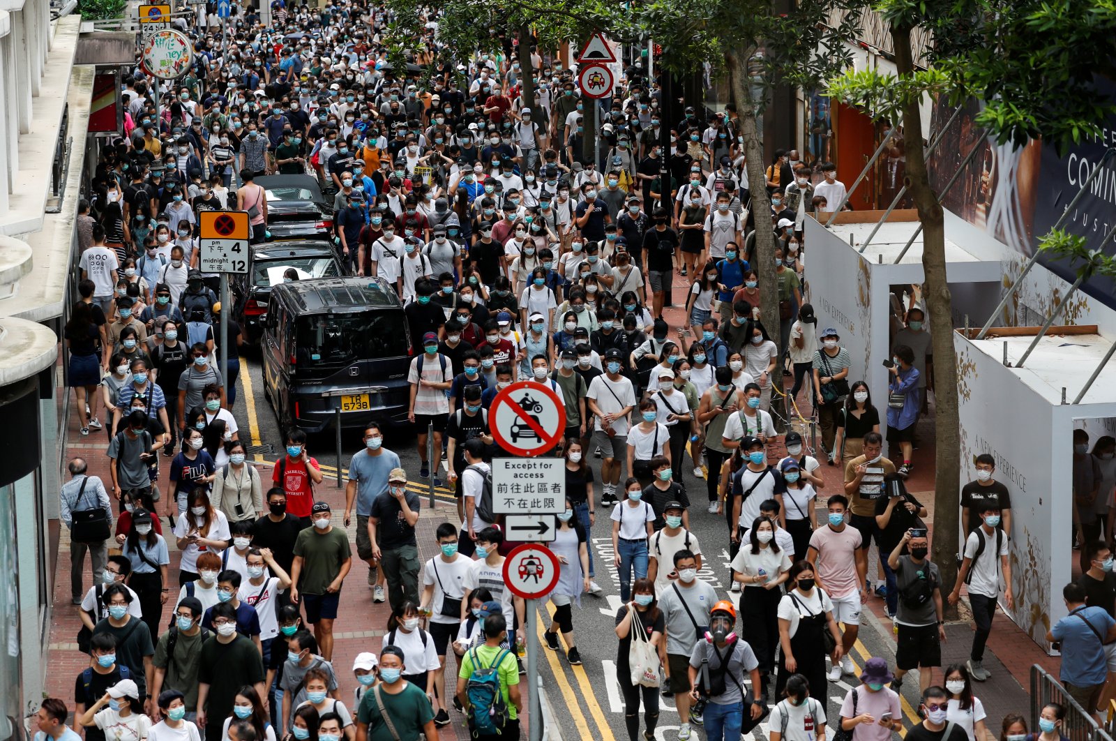 Anti-national security law protesters march at the anniversary of Hong Kong's handover to China from Britain, in Hong Kong, July 1, 2020. (REUTERS Photo)