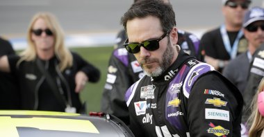 In this Feb. 16, 2020 file photo Jimmie Johnson climbs intp his car before the NASCAR Daytona 500 auto race at Daytona International Speedway in Daytona Beach, Fla. (AP Photo)