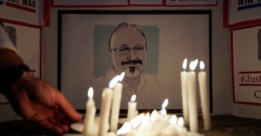 People hold a candlelight vigil to mark the anniversary of slain journalist Jamal Khashoggi, in front of the Saudi Embassy in Washington, D.C., Oct. 2, 2019. (Reuters Photo)
