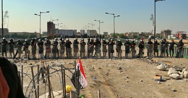 Security forces close the bridge leading to the Green Zone during a demonstration, Baghdad, Oct. 26, 2019. (AP Photo)