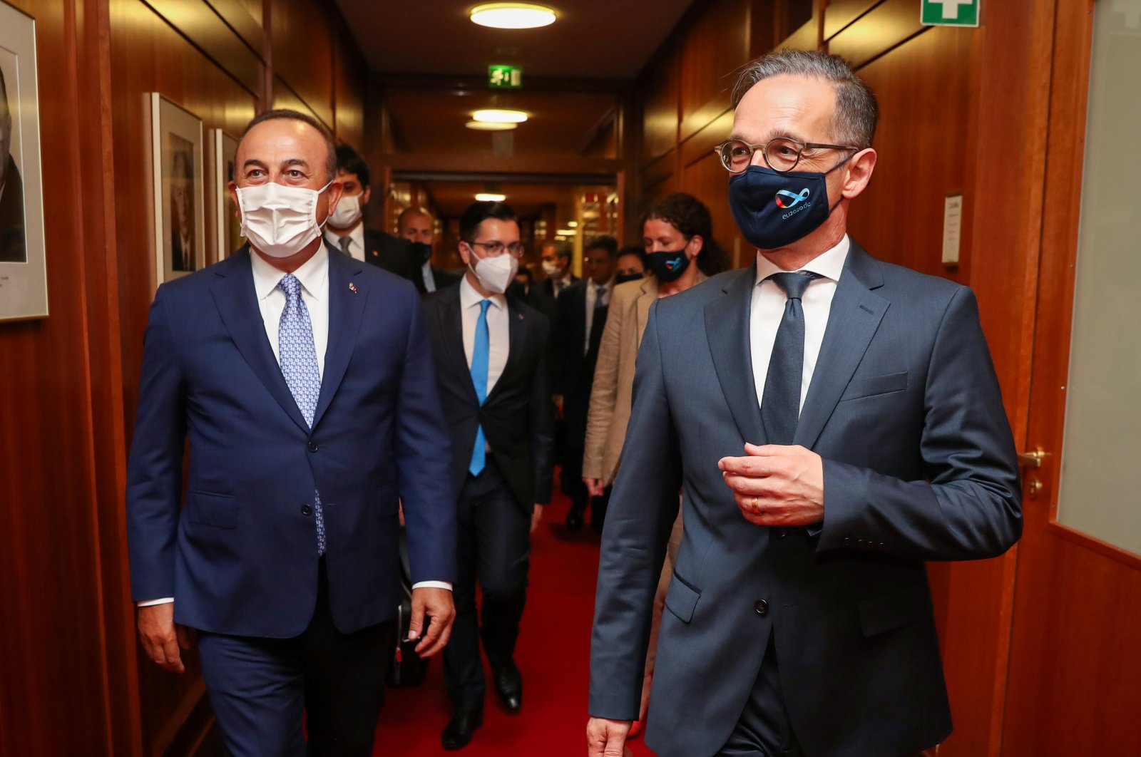 German Foreign Minister Heiko Maas and his Turkish counterpart Mevlut Cavusoglu, wearing protective face masks, walk before their meeting in Berlin, Germany July 2, 2020. (AA Photo)