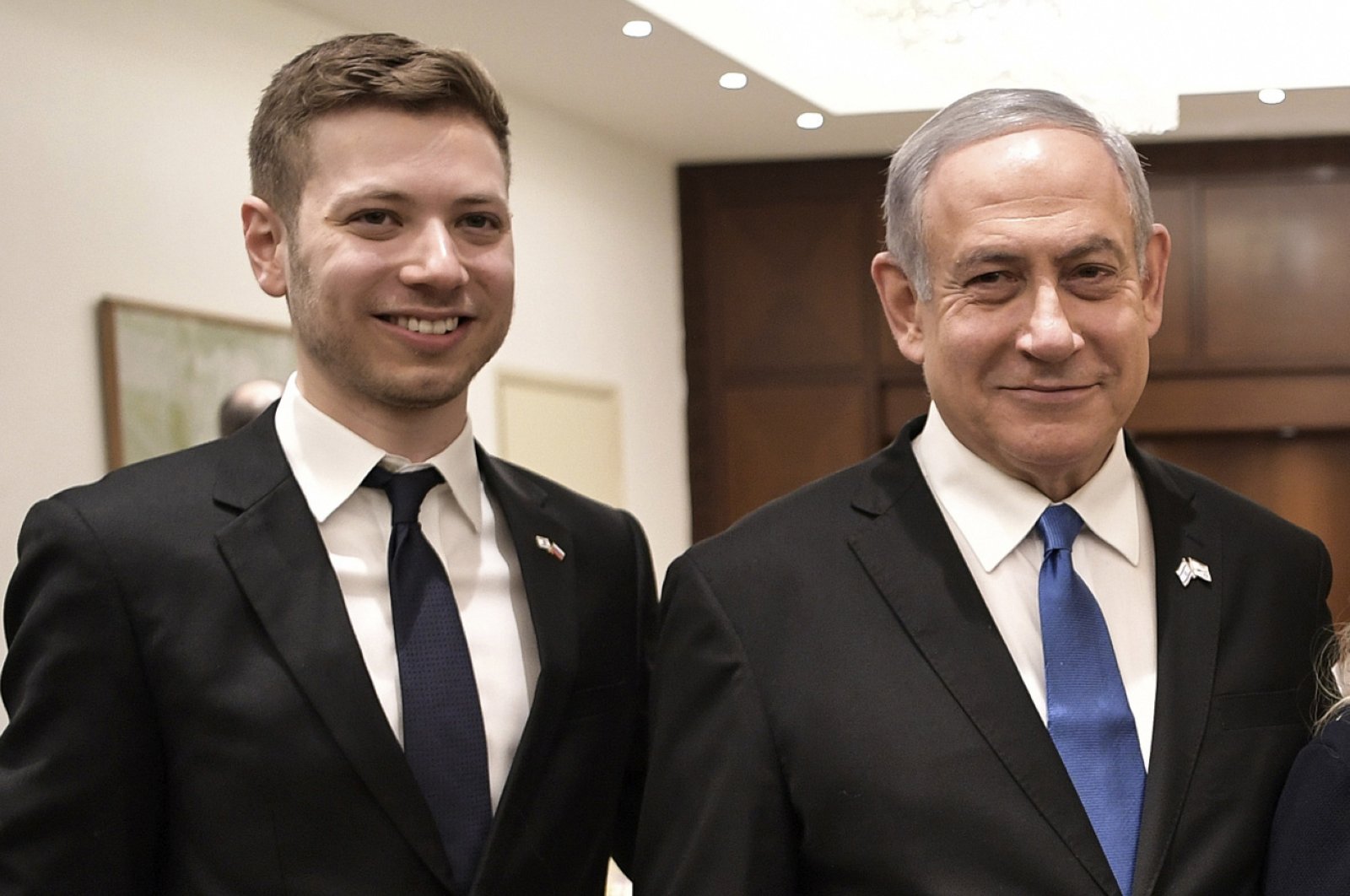 Israeli Prime Minister Benjamin Netanyahu, Yair Netanyahu pose for a photo, Tel Aviv, Jan. 23, 2020. (AP Photo)